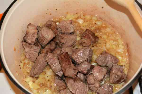 Dutch Oven Beef Stew-Fried Beef Cubes Over Frying Vegetables in the Dutch Oven