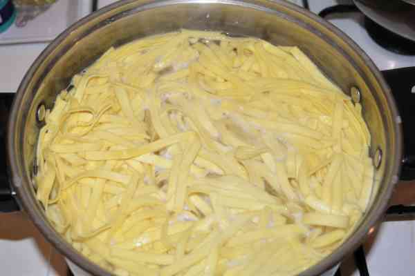 Noodle Kugel With Raisins-Boiling Tagliatelle in the Pot