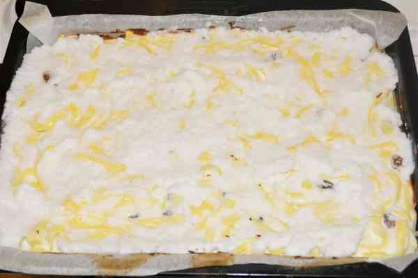 Noodle Kugel With Raisins-Egg Whites Foam Over the Half Ready Baked Cake