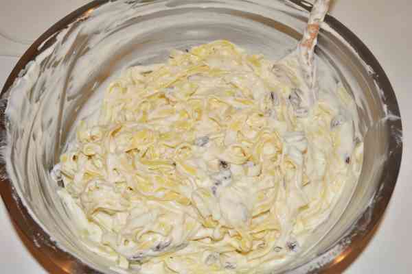 Noodle Kugel With Raisins-Mixed Tagliatelle with Cheese Cream in the Bowl