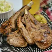 Greek Lamb Chops Recipe-Served on Plate With Brussels Sprouts and a Glass of Beer