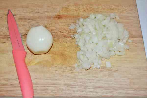 Pork and Sauerkraut Goulash-Chopping the Onions on the Chopping Board