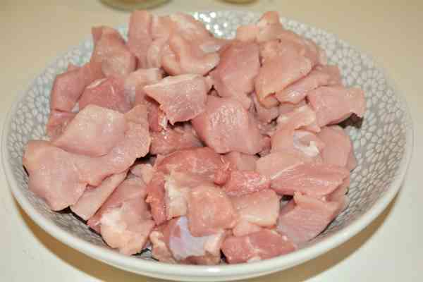 Pork and Sauerkraut Goulash-Pork Shoulder Cut in Cubes in the Bowl
