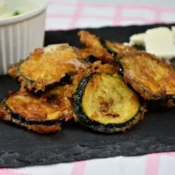 Battered Fried Zucchini-Served on Slab With Garlic Cream and Cheddar Cheese