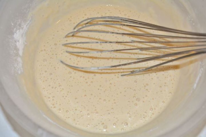 Battered Fried Zucchini-Beer Batter in the Bowl Smooth, airy beer batter whisked with flour, eggs, and chilled beer in a mixing bowl.