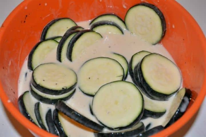 Battered Fried Zucchini-Sliced Zucchini in the Beer Batter Zucchini slices dipped and coated thoroughly in beer batter before frying.