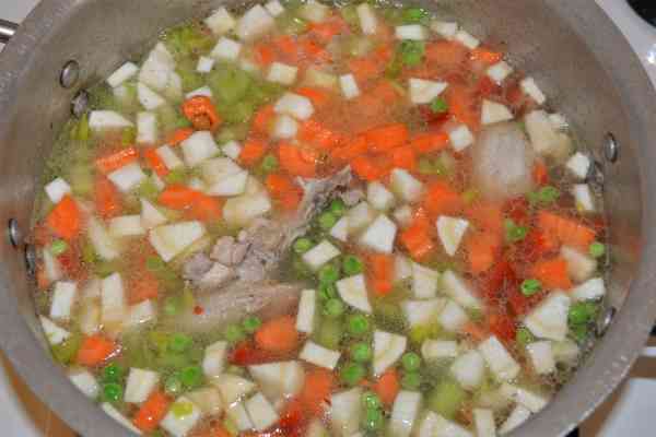 Creamy Chicken Soup With Vegetables-Boiling Fried Chicken Parts With Vegetables in the Pot