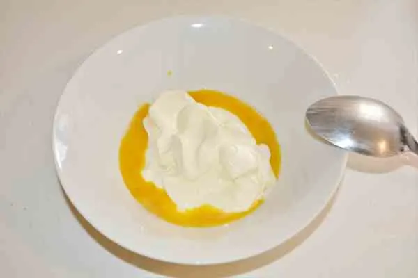 Creamy Chicken Soup With Vegetables-Egg Yolk and Sour Cream in the Bowl