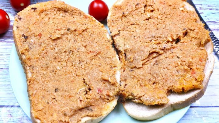 Meatloaf Pate Recipe-Meatloaf Pate Recipe-Two Slices of Bread Spread With Pate Hungarian Pork Meat Spread Served With Bread and Cherry Tomatoes on Plate