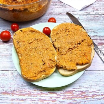 Hungarian Pork Meat Spread Served With Bread and Cherry on Plate