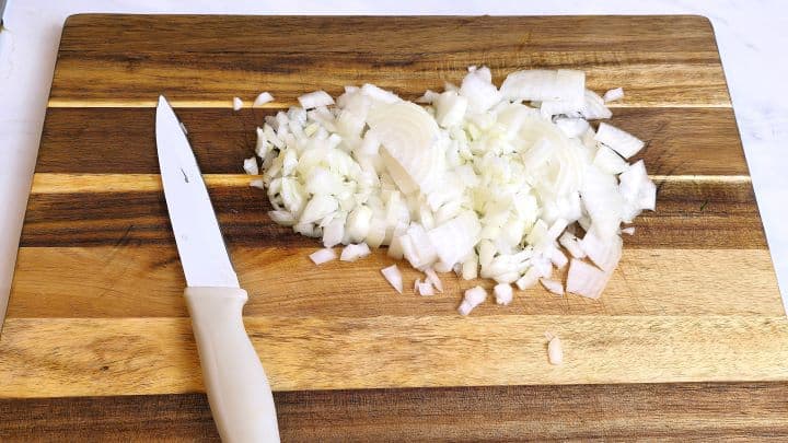 Hungarian Stuffed Peppers-Chopped Onion on Chopping Board Chopped Onion on the Cutting Board