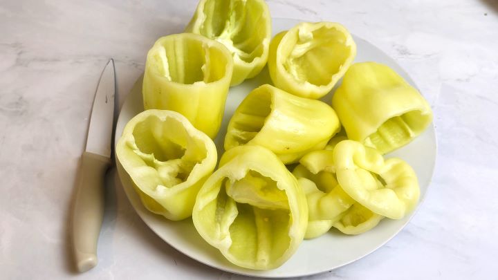 Hungarian Stuffed Peppers-Prepared Peppers to be Stuffed Yellow Sweet Peppers Ready for Stuffing on the Plate