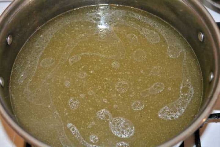Clean beef and vegetables broth in the pot.