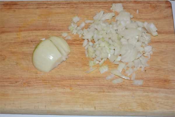 Turkey Lasagna With White Sauce-Chopped Onions on the Chopping Board