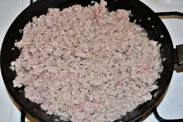 Turkey Lasagna With White Sauce-Fried Ground Turkey and Chopped Onions in the Frying Pan