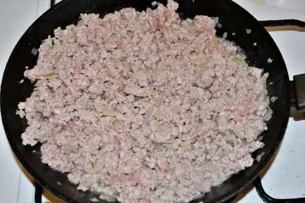 Turkey Lasagna With White Sauce-Fried Ground Turkey and Chopped Onions in the Frying Pan