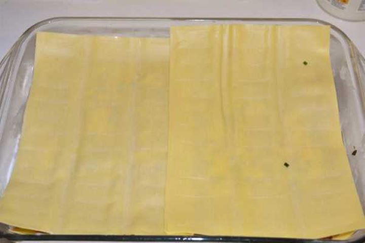 Turkey Lasagna With White Sauce-Two Lasagna Sheets on the First Filling Layer Adding the second layer of fresh lasagna sheets into the baking dish.