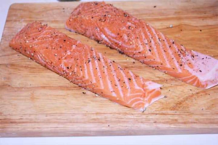 Seasoned Salmon Ground Pepper Seasoned Salmon Fillets on Chopping Board
