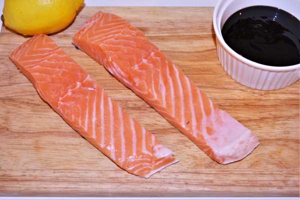 Air Fryer Teriyaki Salmon-Salmon Fillet, Teriyaki Sauce and Lemon on the Chopping Board