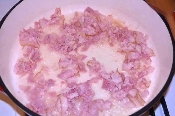 Hungarian Mushroom Paprikash-Frying Chopped Bacon in the Pan