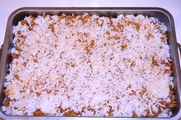 Layered Sauerkraut Casserole-Rice is the Fourth Layer in the Baking Dish