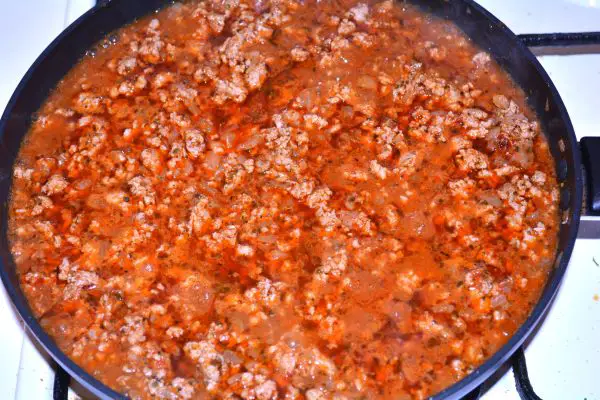 Layered Sauerkraut Casserole-Simmering Pork Mince in the Pan