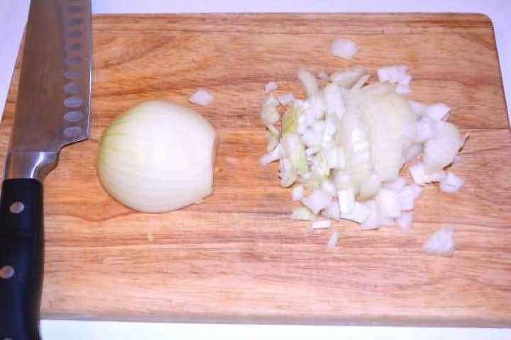 Hungarian Mushroom Paprikash-Chopped Onion Chopped Onion on Cutting Board