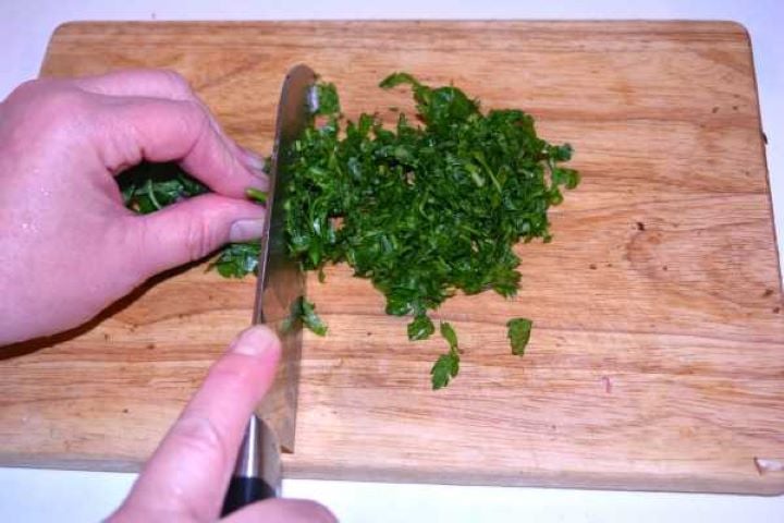 Hungarian Mushroom Paprikash-Chopping Parsley on the Chopping Board Chopping Parsley on the Chopping Board