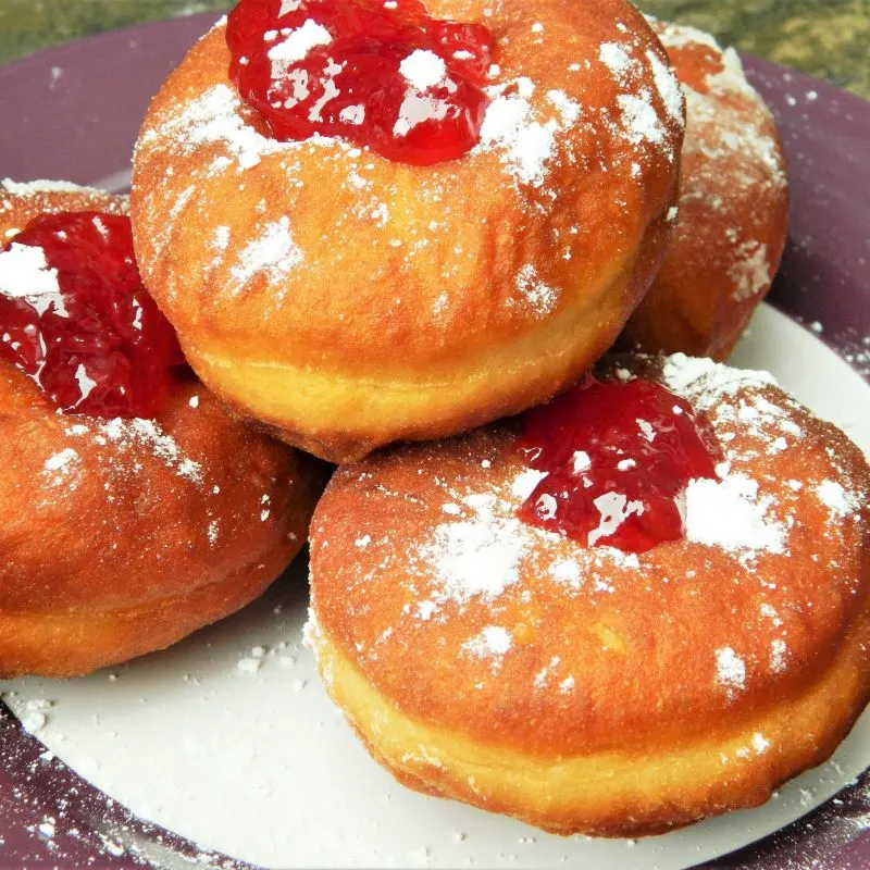 Perfect Yeast Doughnuts Served on Plate With Raspberry Jam on Top
