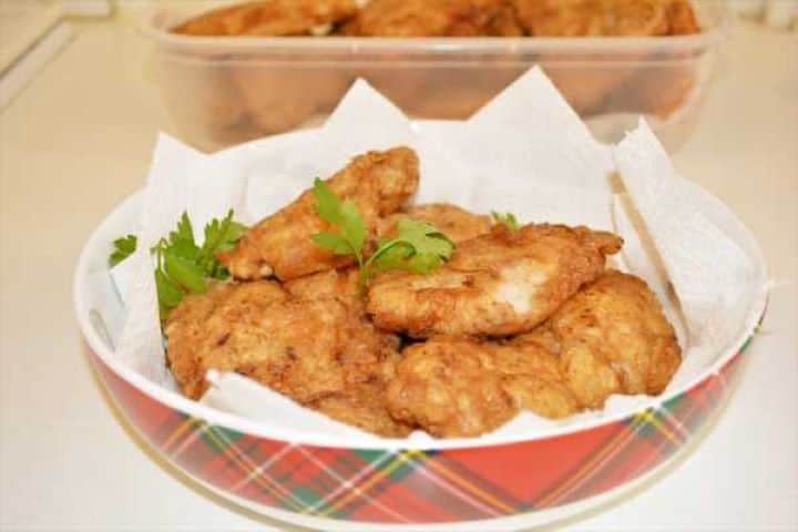 Turkey Schnitzel Recipe-Fried Battered Turkey Slices in the Bowl Ready to Serve Stack of golden, tender turkey schnitzel cutlets in a bowl ready to serve.