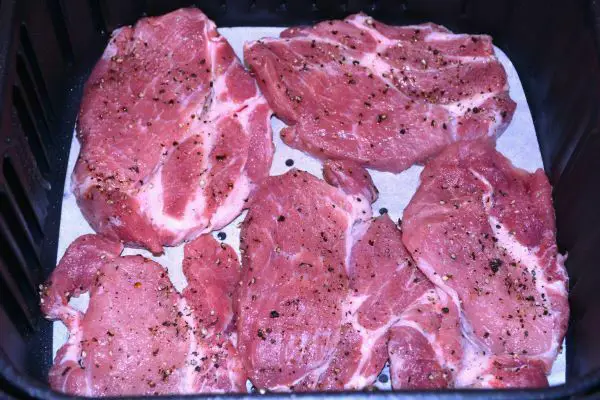 Pork Steak in Air Fryer-Salt and Pepper Seasoned Pork Shoulder Steaks in the Air Fryer Basket