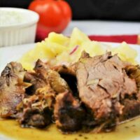 cropped-Slow-Roasted-Leg-of-Lamb-Recipe-Served-on-Plate-With-Potato-Salad-and-Tzatziki5.jpg