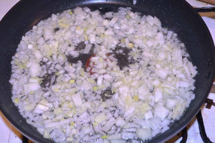 Stuffed Turkey Tenderloin Recipe-Frying Chopped Onion in the Frying Pan Sautéing finely minced yellow onions in sunflower oil in a non-stick skillet.