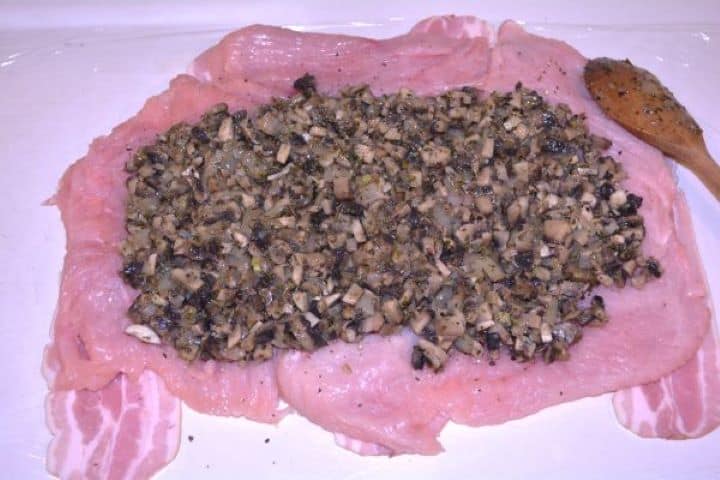 Stuffed Turkey Tenderloin Recipe-Sautéed Mushrooms on the Seasoned Tenderized Turkey Breast Sautéed mushroom mixture spread evenly over turkey breast leaving a one-inch clean border.