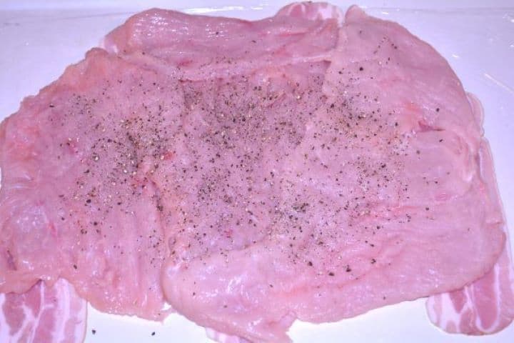 Stuffed Turkey Tenderloin Recipe-Seasoned Tenderized Turkey Breast on the Smoked Bacon Slices Tenderized turkey tenderloin seasoned with salt and pepper placed directly over smoked bacon slices.