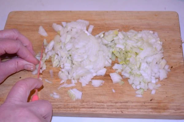 Stuffed Turkey Tenderloin Recipe-Chopping Onion on the Chopping Board
