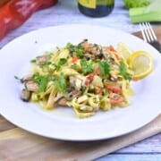 Frozen Mussels Recipe-Shelled Mussels With Tagliatelle Pasta in Cream and White Wine Sauce Served on White Plate