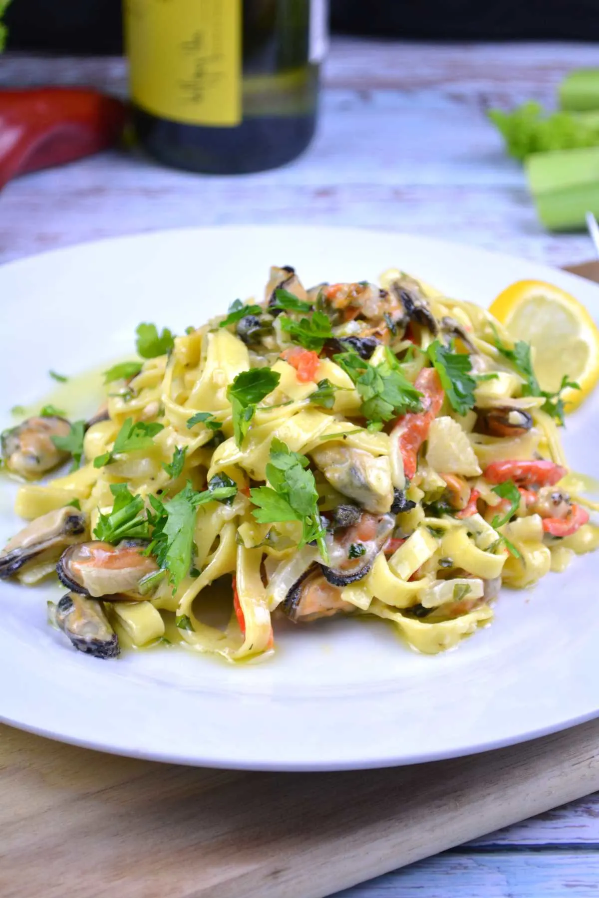 Frozen Mussels Recipe-Shelled Mussels With Tagliatelle Pasta in Cream and White Wine Sauce Served on Plate