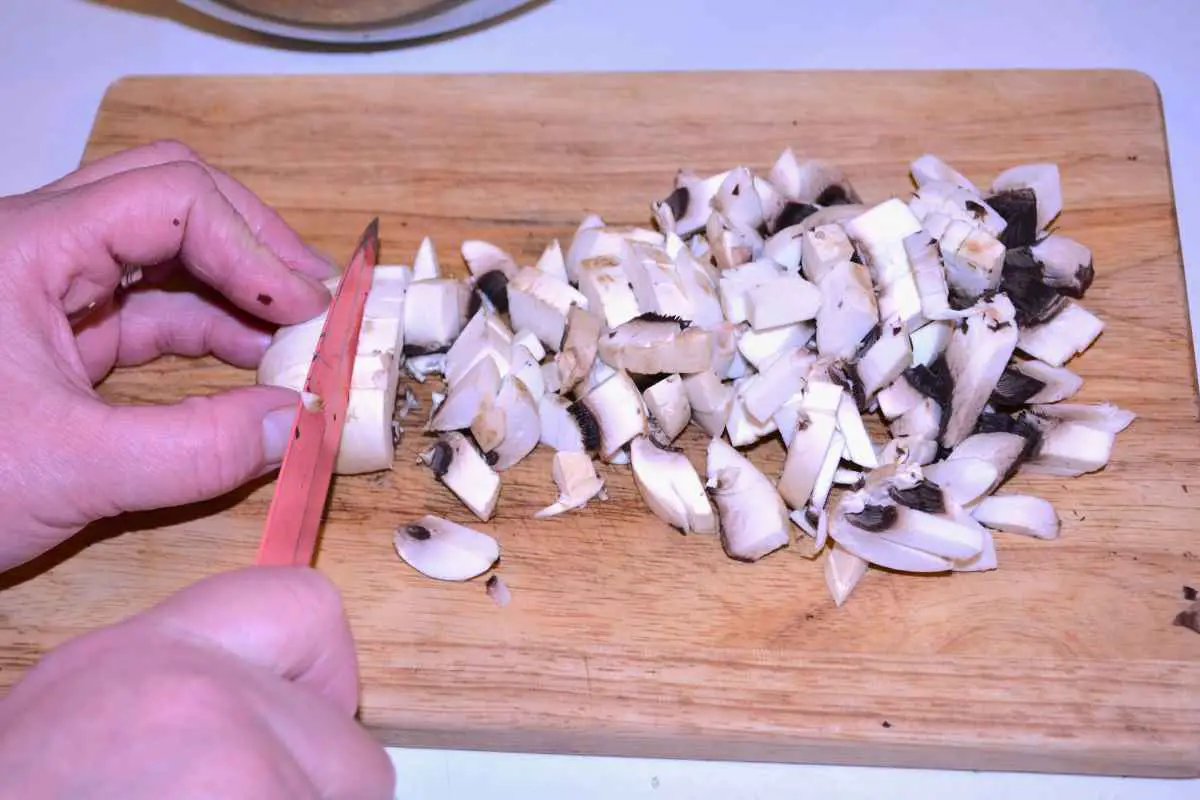 Mushroom Salad With Mayonnaise-Chopping Mushrooms on the Chopping Board