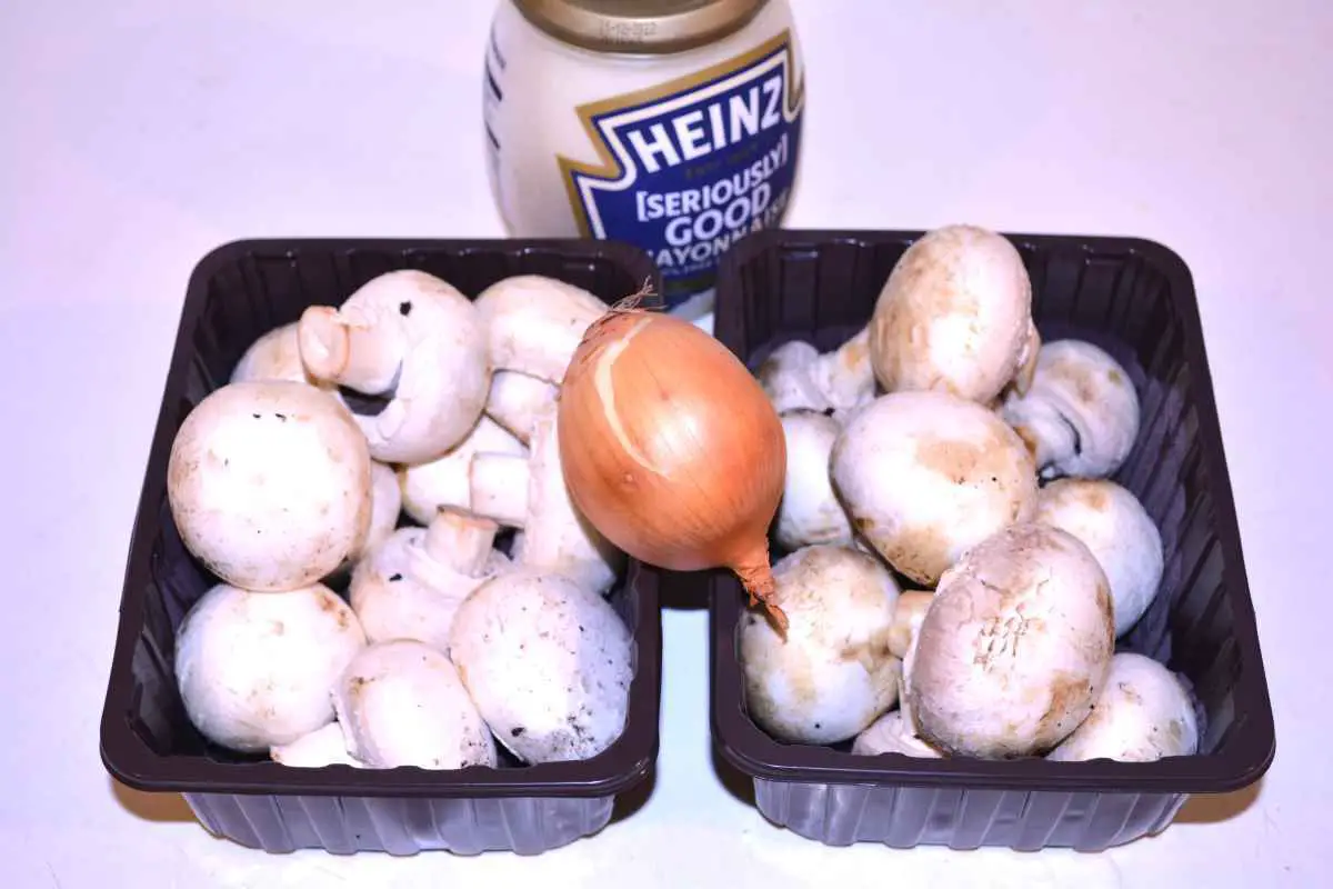 Mushroom Salad With Mayonnaise-White Mushrooms, Onion and Jared Mayonnaise on the Table