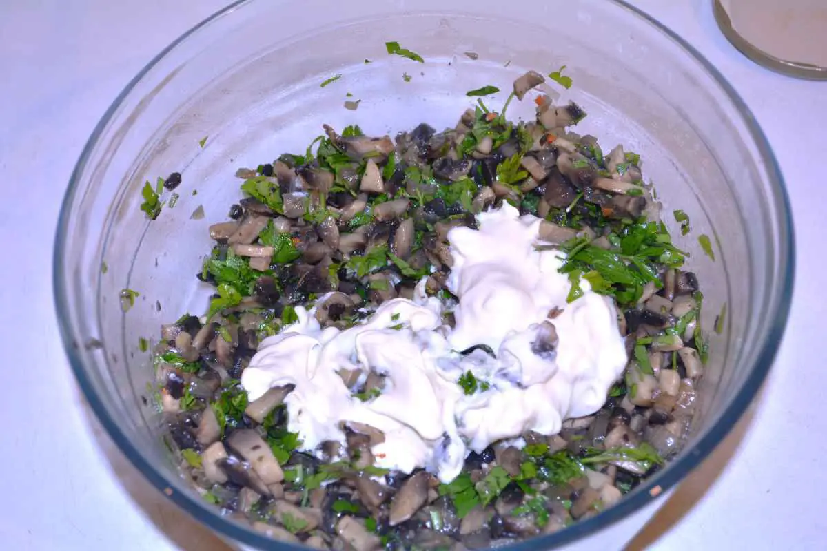 Mushroom Salad With Mayonnaise-Sautéed Mushrooms, Parsley and Sour Cream in the Glass Bowl
