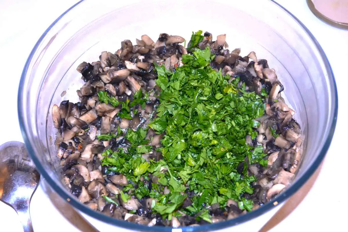 Mushroom Salad With Mayonnaise-Sautéed Mushrooms and Chopped Parsley in the Glass Bowl