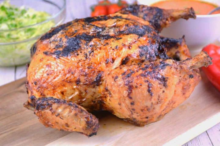 Served Crispy Air Fryer Whole Chicken Served on the Chopping Board
