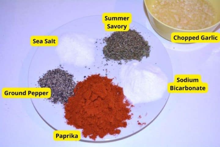 Spices Seasonings for Romanian mici including Hungarian paprika, dried summer savory, garlic, sea salt, black pepper, and baking soda.