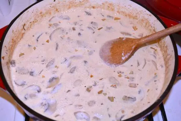 Chicken and Mushroom Alfredo-Cream and Milk on the Sautéed Mushrooms in the Pot