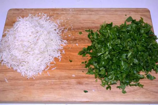 Chicken and Mushroom Alfredo-Grated Parmesan and Chopped Parsley on the Chopping Board