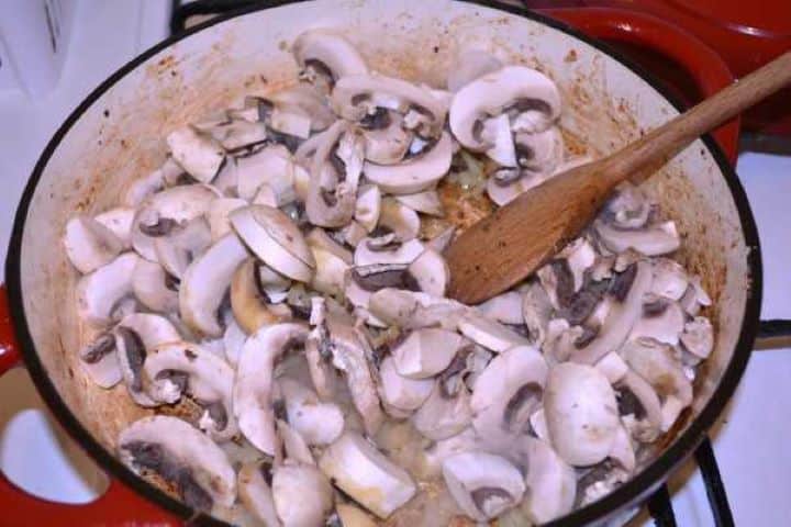 Mushrooms in Pot Sauteing Sliced Mushrooms in the Deep Pan