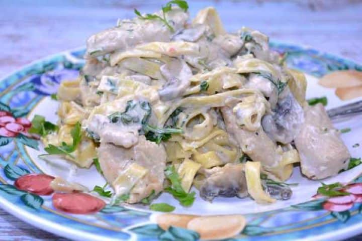 Serving One-Pot Chicken and Mushroom Alfredo Served on Blue Plate