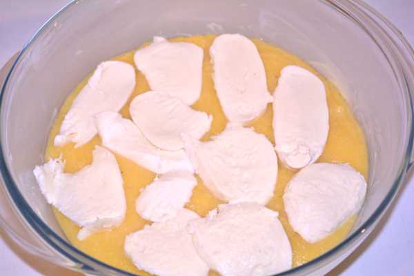 Creamy Mozzarella Polenta-Sliced Mozzarella on the First Layer of Polenta
