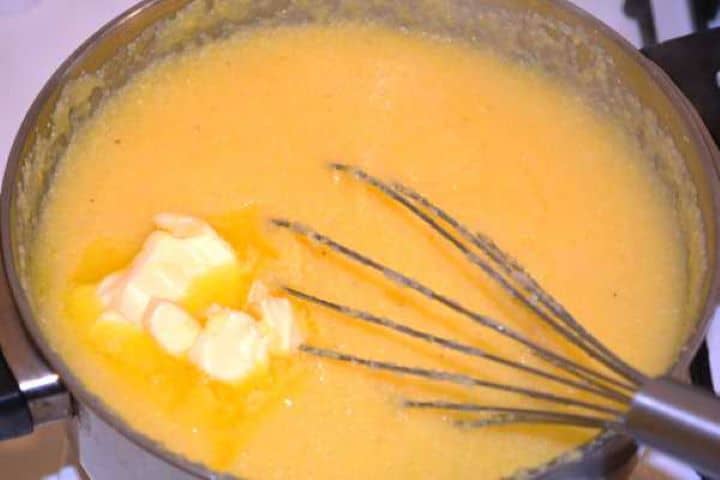 Butter in Polenta Stirring a knob of unsalted butter into hot cooked polenta until melted and smooth.